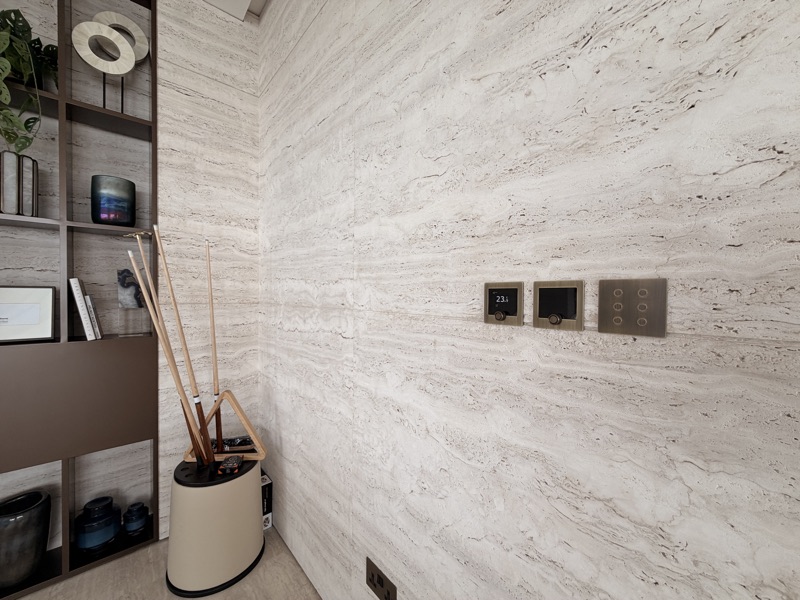 Coordinated wall controls for room temperature and lighting scenes.
