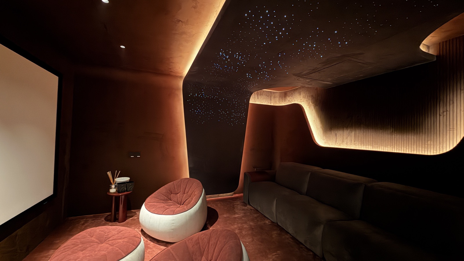 Projection and room design come together in a private entertainment space.