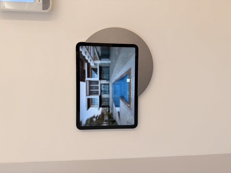 A home touchscreen with Sonos, lighting, climate and shading options.